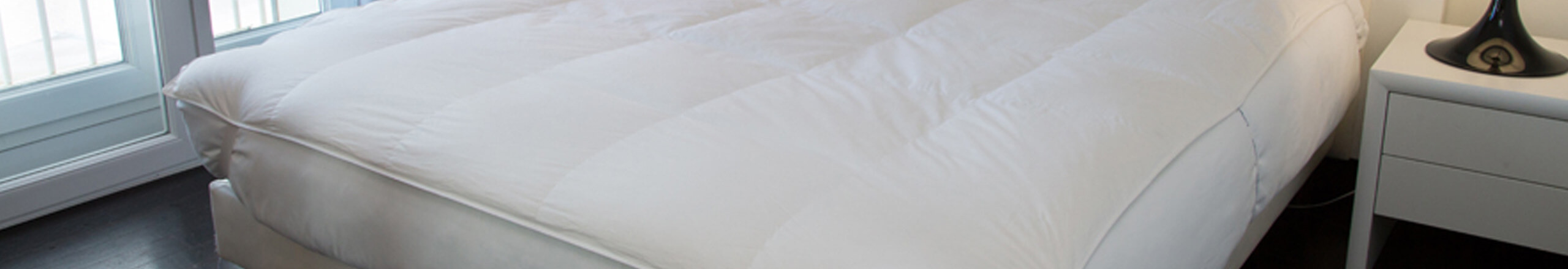 Surmatelas en duvet et plume