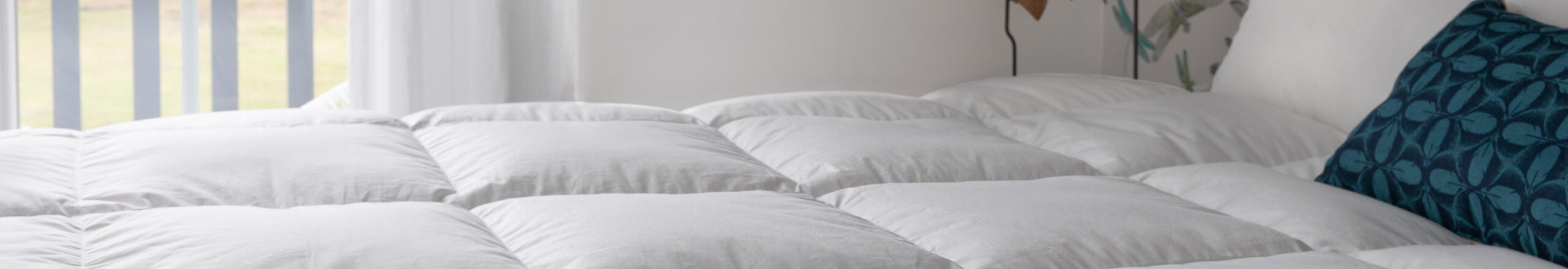 Couette pas cher en plume et duvet